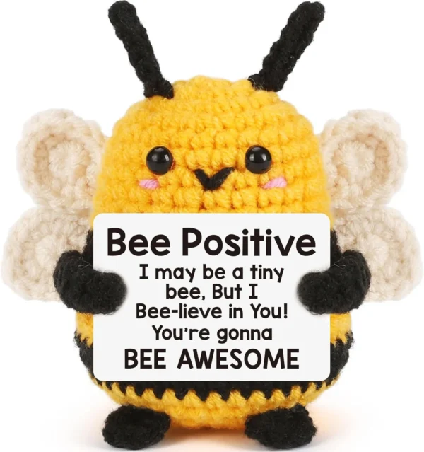 Yellow crochet bee gift holding a positive message card