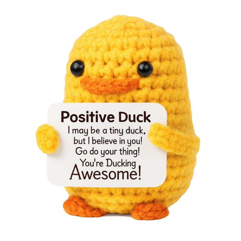 Yellow crochet duck holding a positive message card, front view