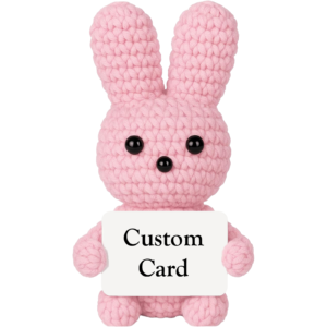 Pink crochet bunny holding a customizable message card — just-because gift